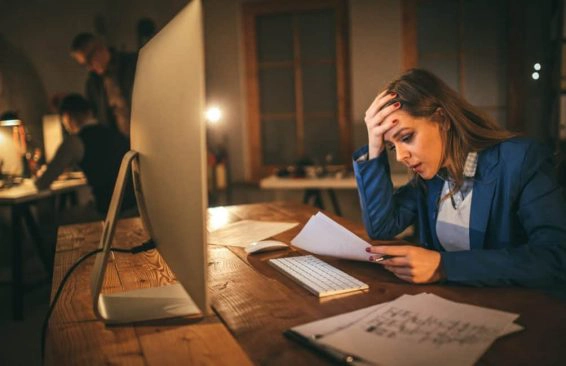 Young woman working late