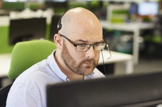 Man taking call in call centre
