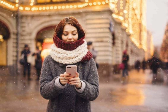 Woman with mobile phone on the street