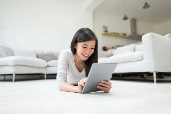 Woman social networking on a tablet computer