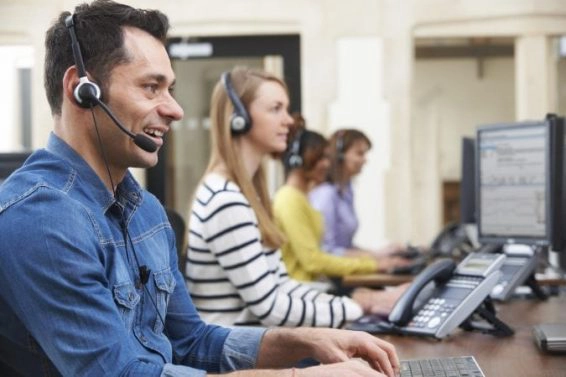 Male customer services agent in call centre