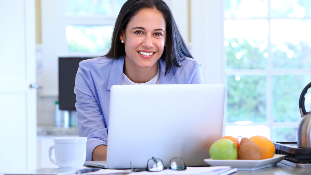 Happy woman at laptop