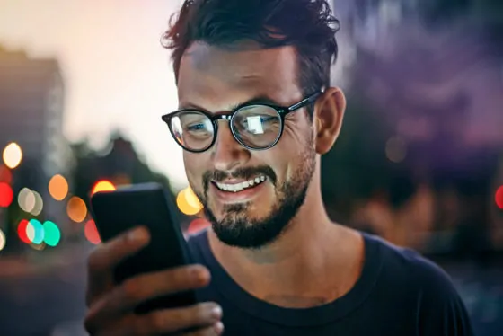 Young man reading text message