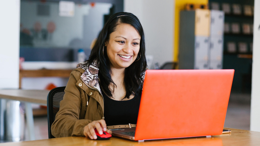 Smiling woman at her laptop