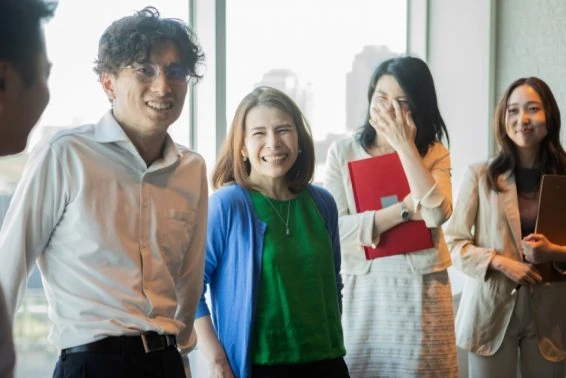 Employees listening to a colleague during a break