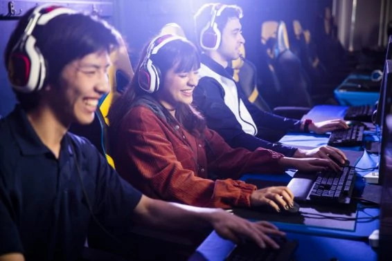 Young call center customer service workers at computer with headset