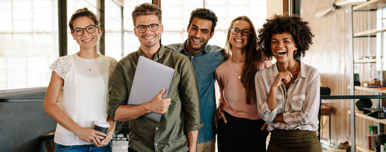 Creative business team laughing together
