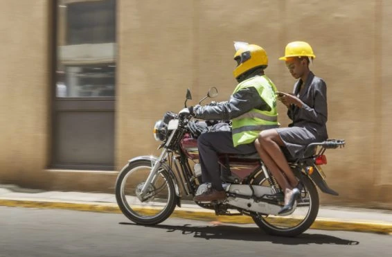 Business woman on a moto taxi