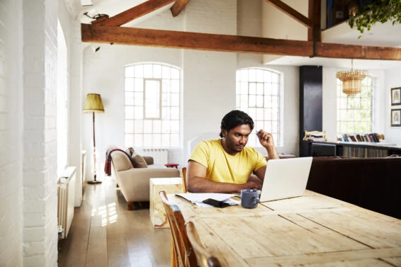 A guy working from home on a sunny day