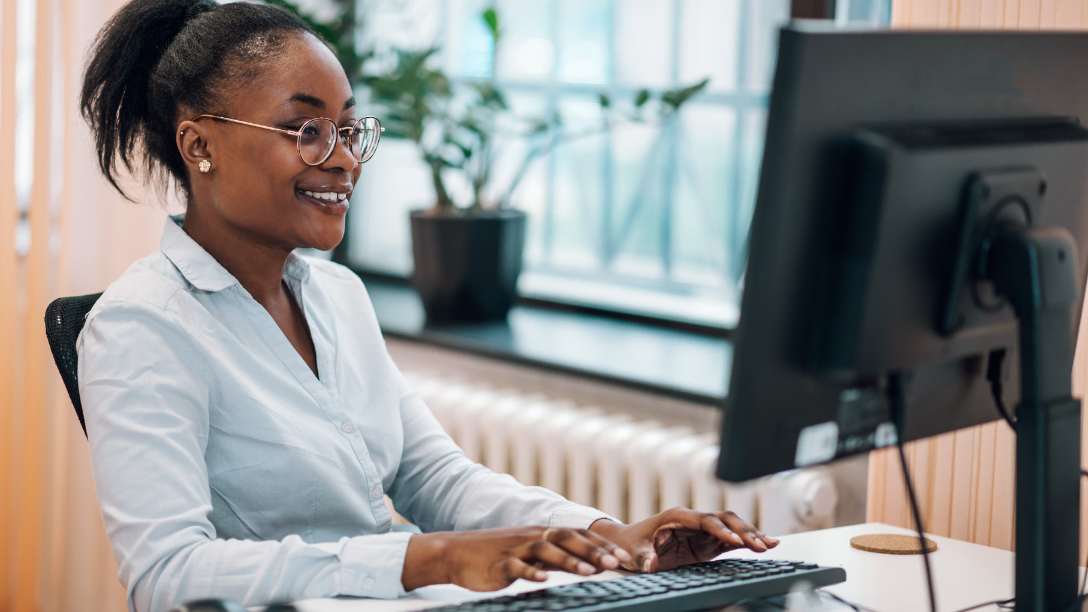 Happy woman working at her computer