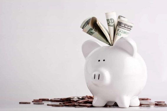One stuffed, overfilled full piggy bank