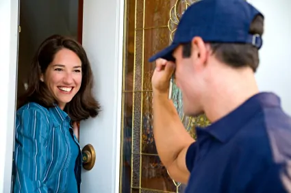 Service technician and woman front door