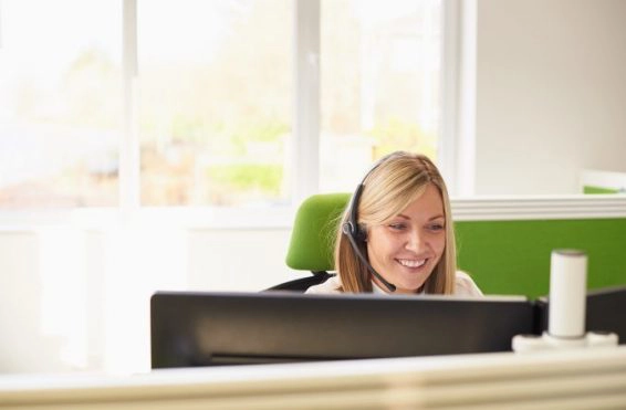 Woman taking call in call centre