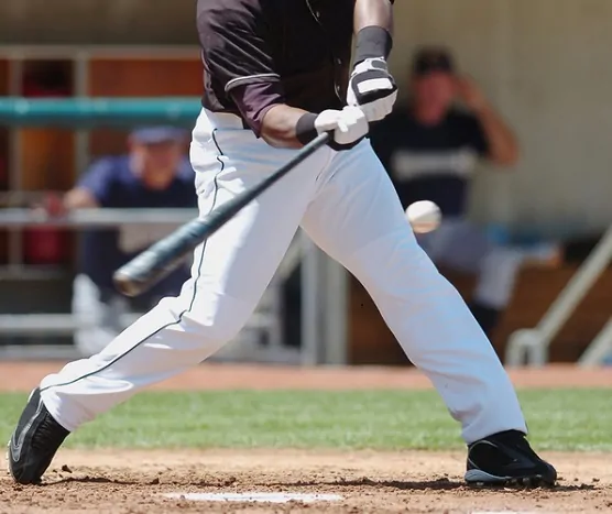 Baseball player swings for the fences.