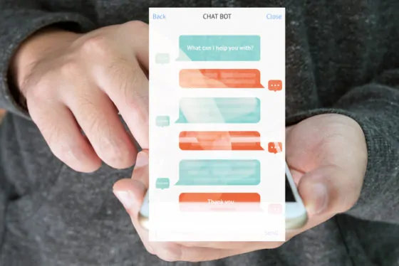 Chat bot and future marketing concept , automatic chatbot message screen with hand holding mobile phone background