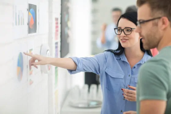 Colleagues conversing about charts
