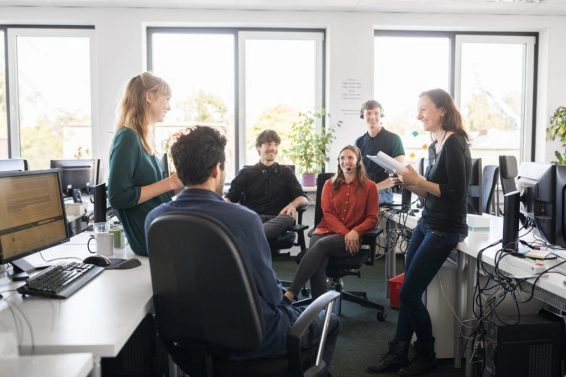Smiling business people discussing in meeting