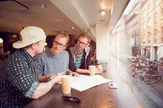 Friends in discussion at a cafe