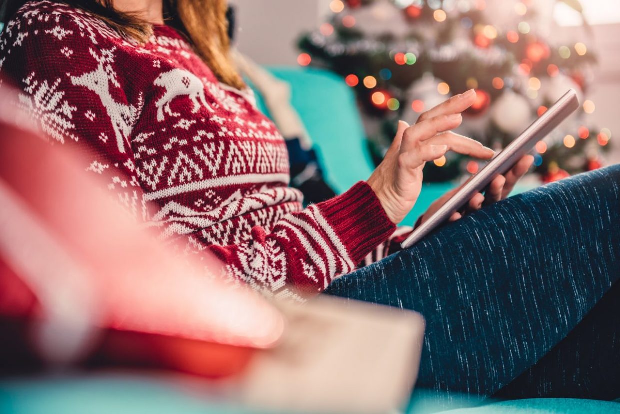 Women using tablet during christmas