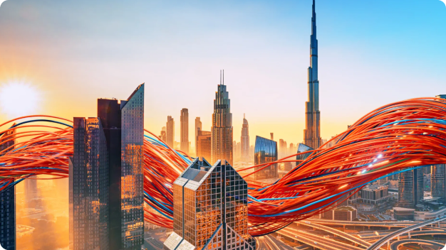 City skyline at sunset with illuminated orchestration threads woven through the buildings