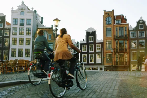 Couple riding bicycles, rear veiw (blurred motion)